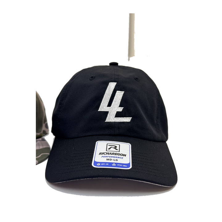 Translation missing: en.A black baseball cap featuring a large white embroidered 'LL' logo on the front and a white Richardson Performance MG-LO sticker on the visor, set against a plain white background