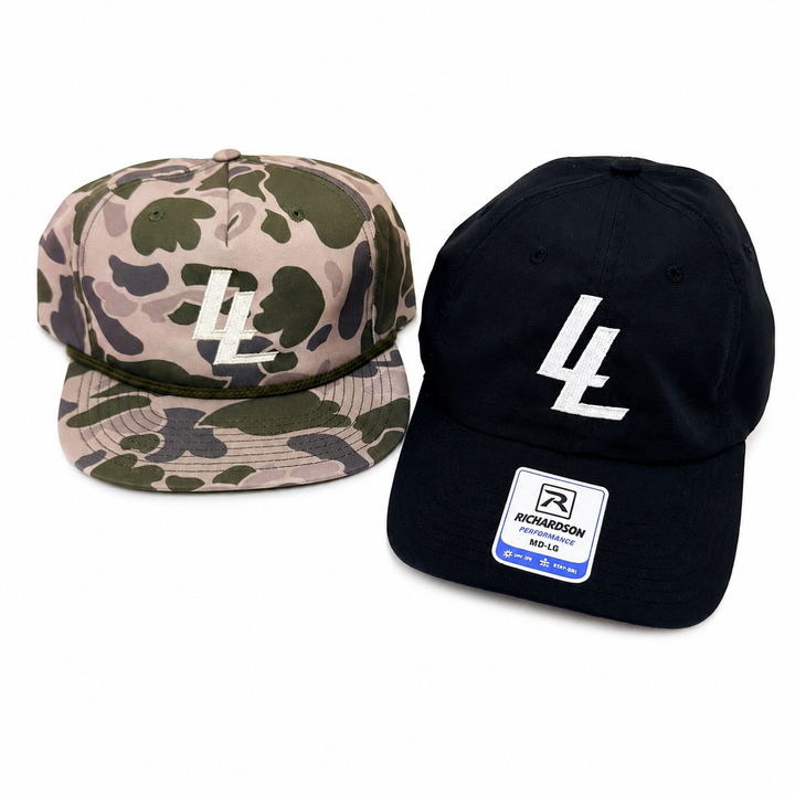 Translation missing: en.Two baseball caps on a plain white background: one in tan, green, and gray camouflage with a cream embroidered LL logo, and one solid black with a large white LLlogo and a visible Richardson 9FOLD patch on the brim
