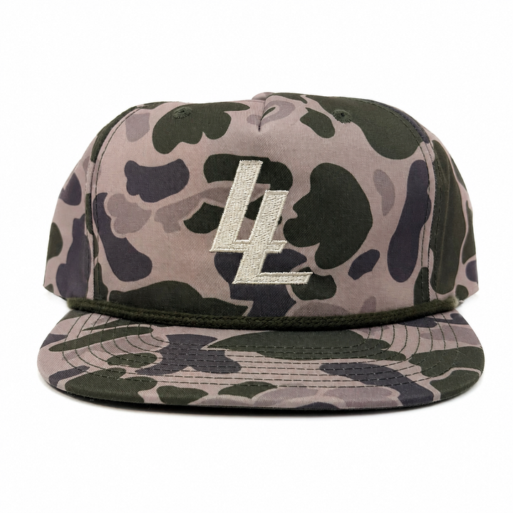 Translation missing: en.A flat-brim baseball cap in a green, brown, and gray camouflage pattern, featuring a prominent silver metallic 'LL' logo on the front panel