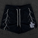 Black shorts with white lightning strike front view