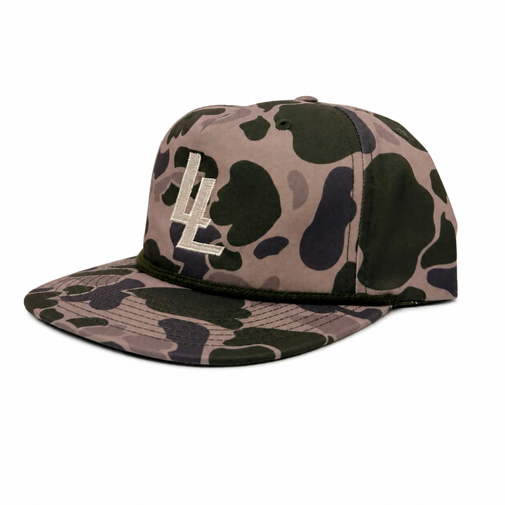 Translation missing: en.A flat-brim baseball cap featuring a brown, green, and black camouflage pattern with an embroidered LL logo on the front, set against a plain white background