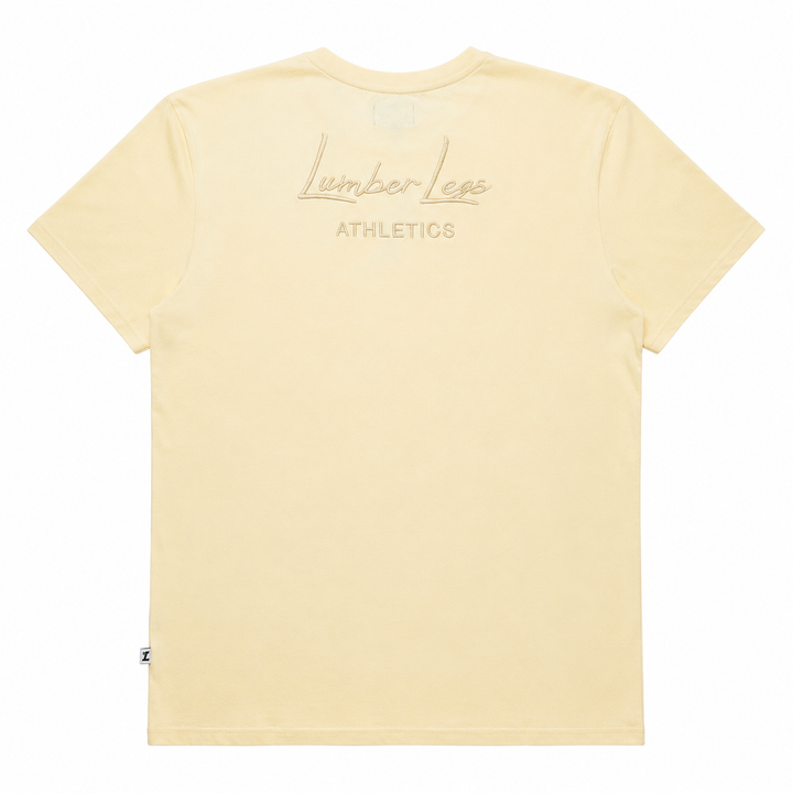 Translation missing: en.A cream short-sleeve t-shirt shown from the back, featuring a tonal embroidered 'LumberLegs Athletics' logo on the upper back
