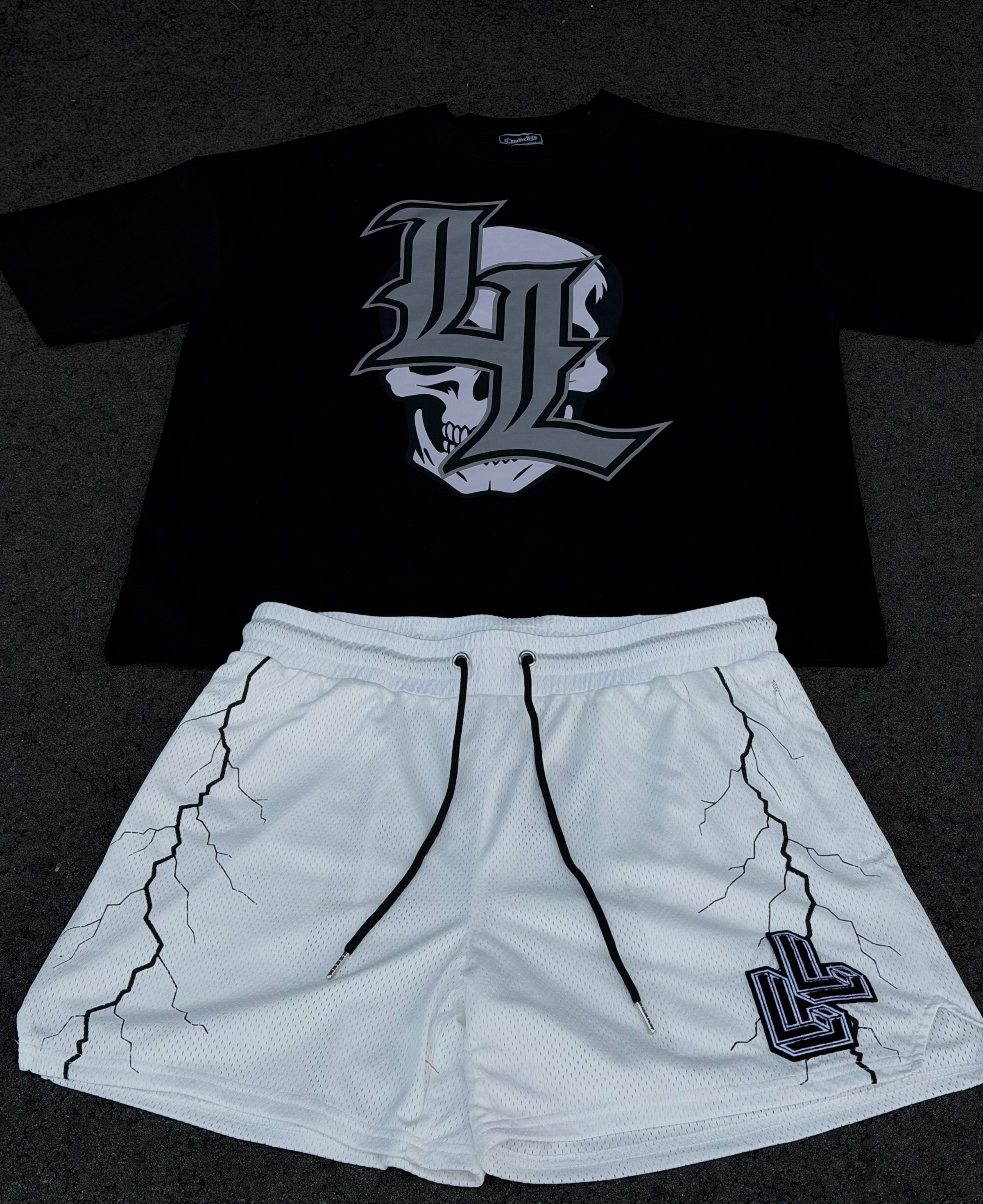 Black t-shirt with skull logo and white shorts with lightning design