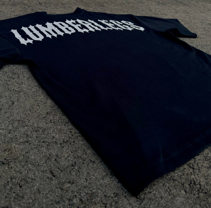 Translation missing: en.Black t-shirt with 'LUMBERLEGS' printed on upper back. Back view