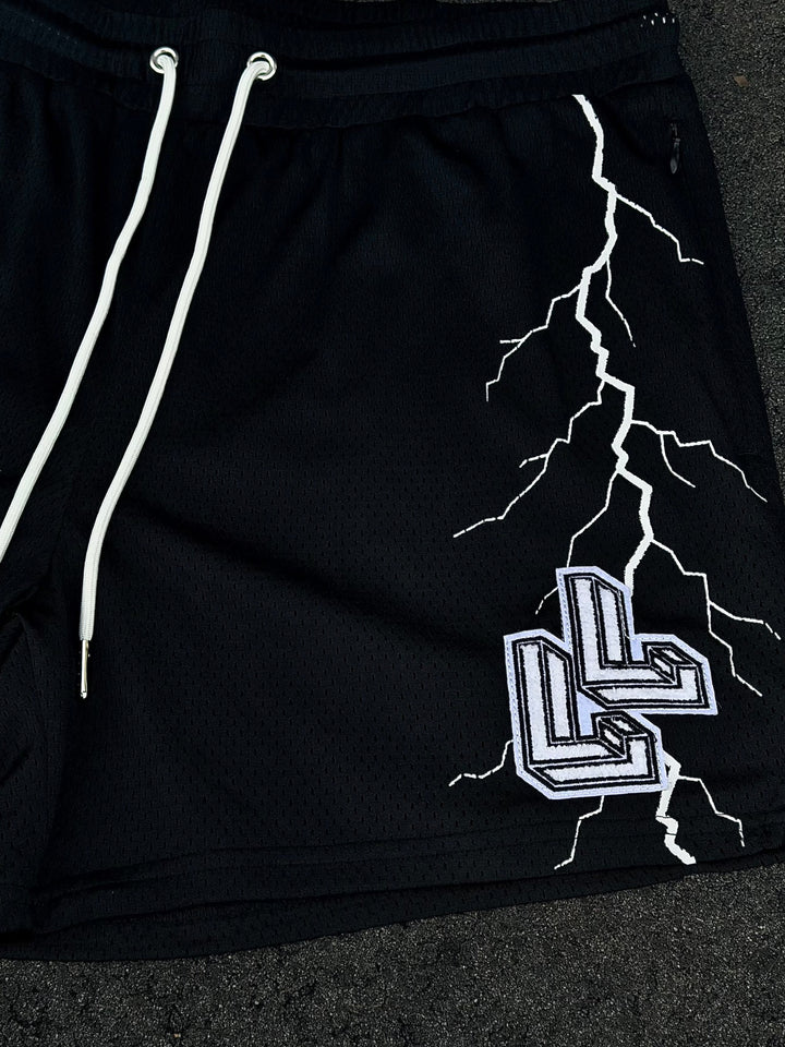 Translation missing: en.Black mesh shorts with white lightning strike LL logo Close-up