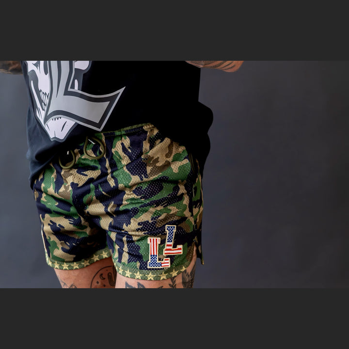 Translation missing: en.Camo mesh shorts on male model with LL American Flag logo