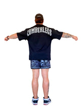 Model wearing oversized LumberLegs black gothic tee shirt