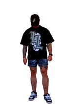 Model wearing LumberLegs black gothic LL logo tee