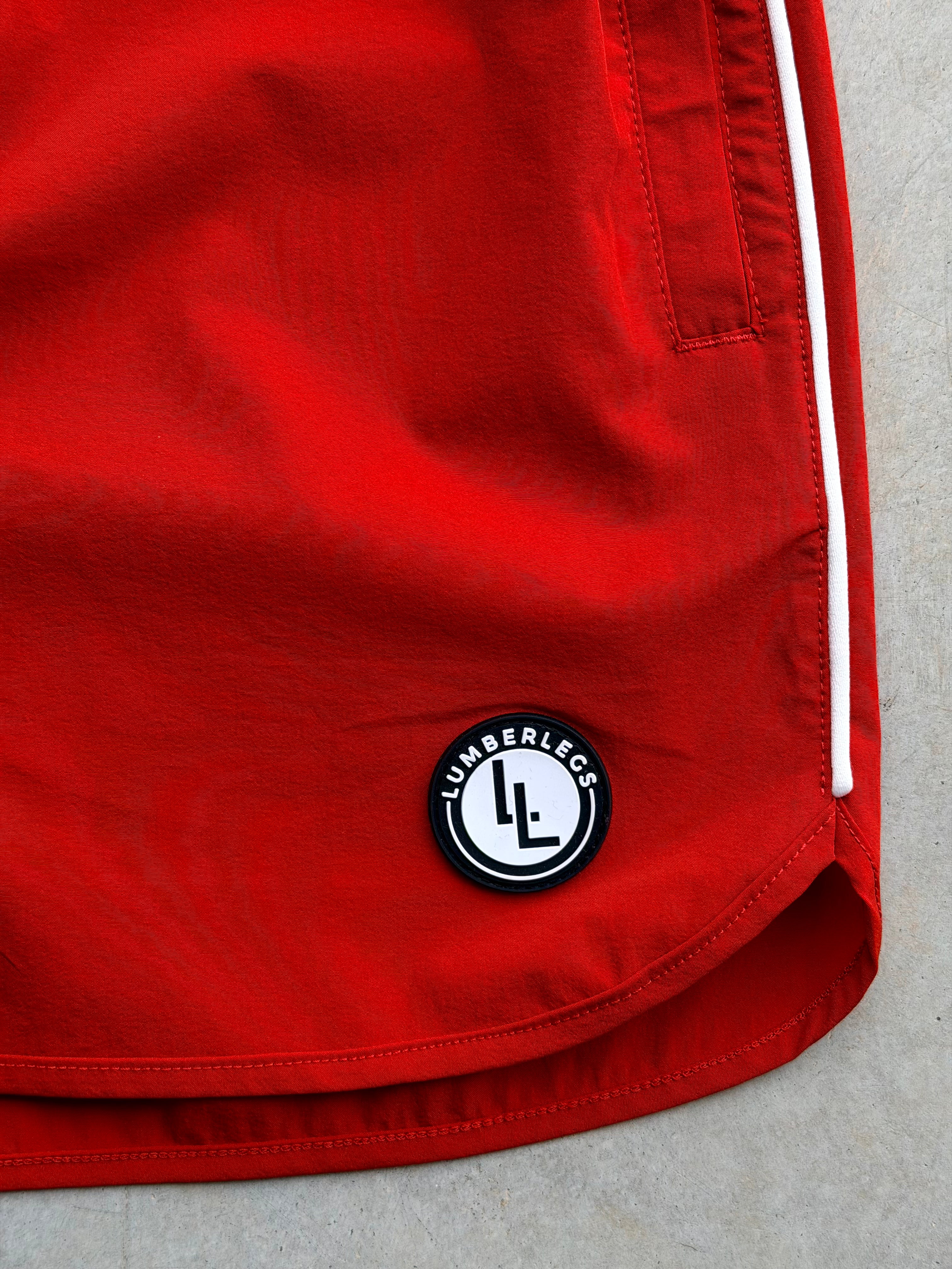 LumberLegs logo patch on Red Riot OG gym shorts