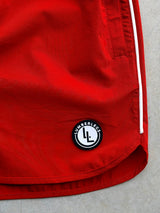 LumberLegs logo patch on Red Riot OG gym shorts