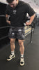 Man Wearing Grave Set Mesh Shorts