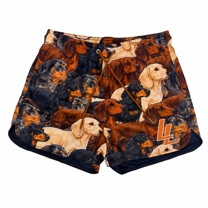 Translation missing: en.A pair of athletic mesh shorts featuring an all-over print of dachshunds in various colors with a brown drawstring. A stylized brown and white 'LL' logo is printed on the lower left leg