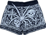 back view of gothic skull and spider mesh shorts